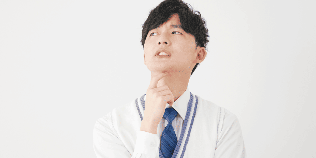 悩んでいる男子高校生